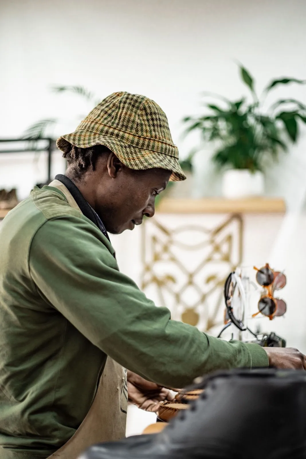The maker at the bench in the Room, beside the wolf panel
